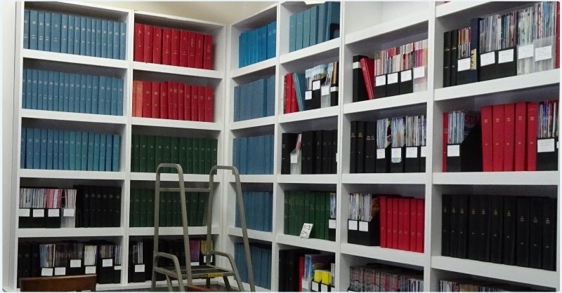 Shelves full of bound magazines and a step ladder to access higher shelves - at the National Model Aviation Museum